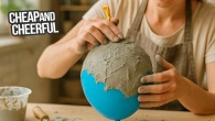 Coat a balloon with cement, you'll be surprised at the results! Incredibly cheap and stylish